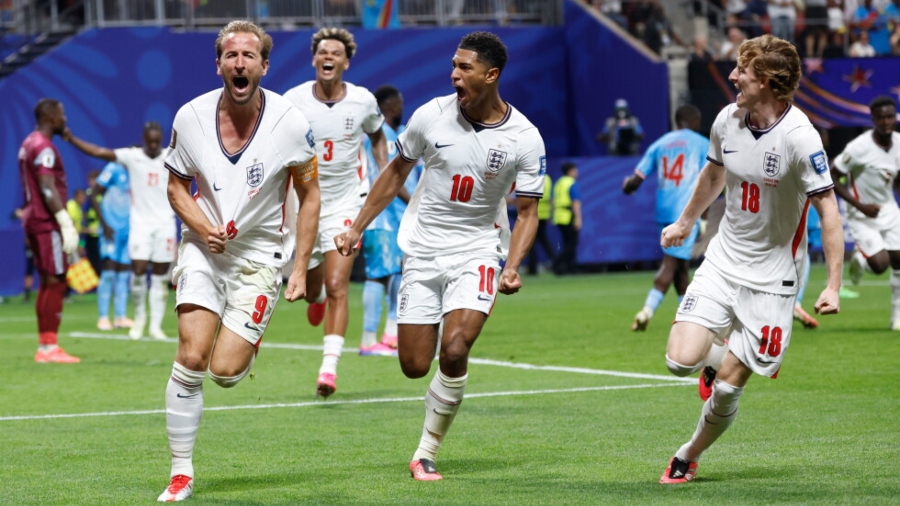 England's Harry Kane (9) celebrates after scoring his side's first goal next to his teammate Jude Bellingham (10) and Anthony Gordon (18) during the World Cup round of 32 soccer match between England and Congo in Atlanta, Wednesday, July 1, 2026. (AP Photo/Butch Dill)